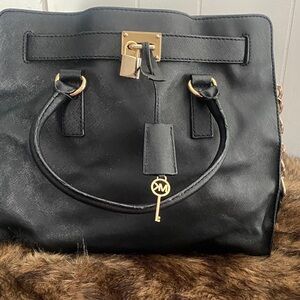 Michael Kors Black Satchel with Gold Accents